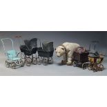 A group of five toy prams, late 19th Century and later, of traditional form and varying sizes,