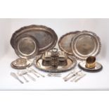 A group of silver plate including: a large circular tray with decorative fruiting vine rim; two