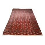 A Bukhara carpet, early to mid 20th century, with five rows of elephant foot guls, the main border