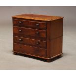 A Victorian mahogany miniature chest, with four long graduated drawers, on squat bun feet, 33cm