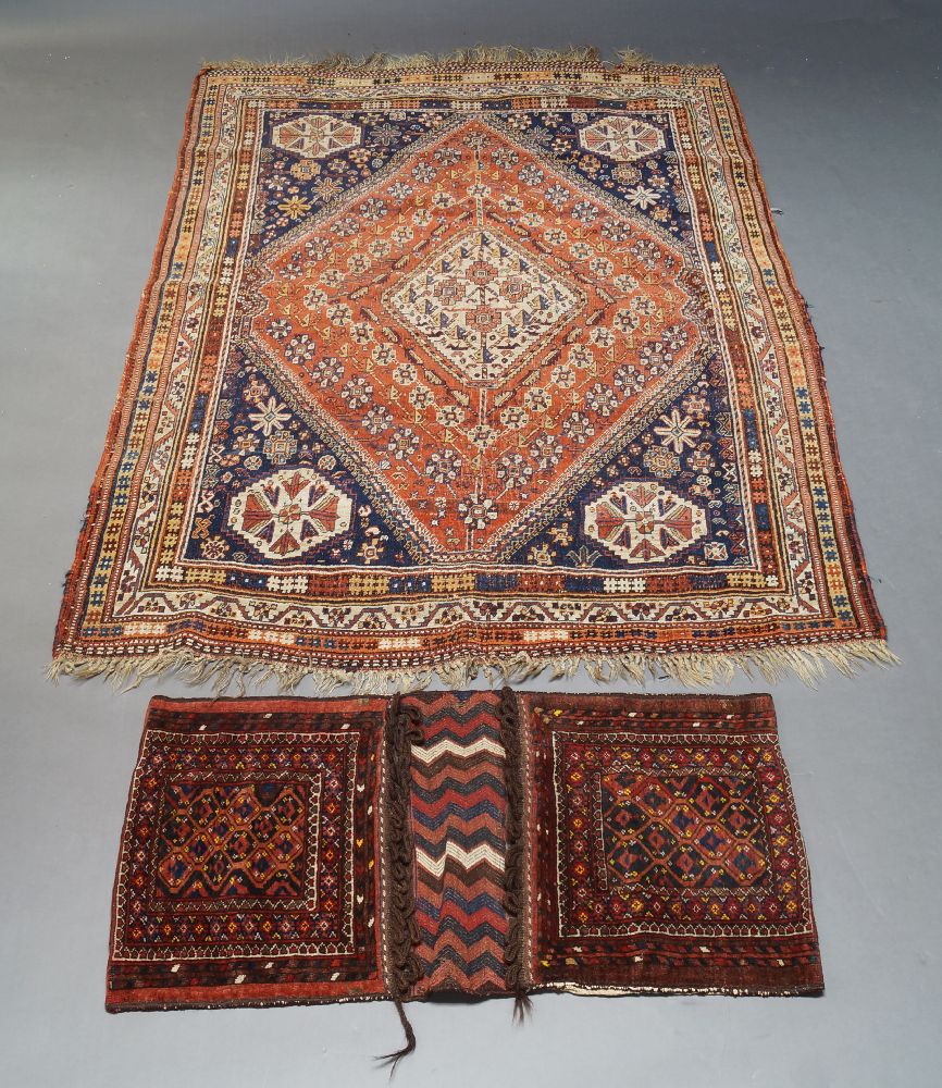 A Qashqai rug, with ivory lozenge in rust coloured field with indigo spandrels, set within