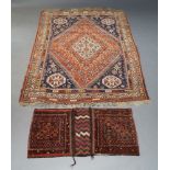 A Qashqai rug, with ivory lozenge in rust coloured field with indigo spandrels, set within