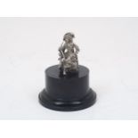 A chromium plated car mascot modelled in the form of a seated cavalier with a pipe, 20th Century,