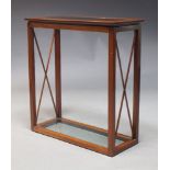 A modern mahogany and glazed console table, late 20th Century, the rectangular top inset with