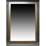 A large contemporary overmantle mirror, of rectangular form with silvered frame, 202cm x 141cm