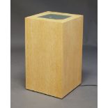 A contemporary limed oak veneered plinth, late 20th Century, the square top inset with glass