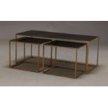 A modern coffee table with two nesting side tables, of recent manufacture, with rectangular black