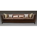 A pair of large contemporary pale pink velvet upholstered sofas, of recent manufacture, with