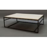A contemporary coffee table, of recent manufacture, with rectangular faux stone top, on cast