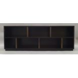 A Contemporary ebonised shelving unit, of recent manufacture, of rectangular form with offset