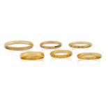 Six gold band rings, including two hallmarked 22ct gold, 6.5g; one 9ct gold band, 1.7g; two gold