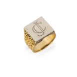 An 18ct gold bi-colour signet ring, by Garrard & Co, the square white gold bezel engraved with the