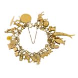 A gold charm bracelet, the 9ct gold bracelet suspending various mid 20th century gold charms,