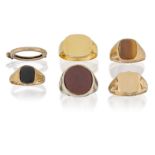 Five signet rings and a clip ring, including: a large cornelian set ring; two 9ct gold signet rings,