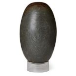 A polished lingham stone, of typical ovoid form, 34cm. long Provenance: Formerly in the collection