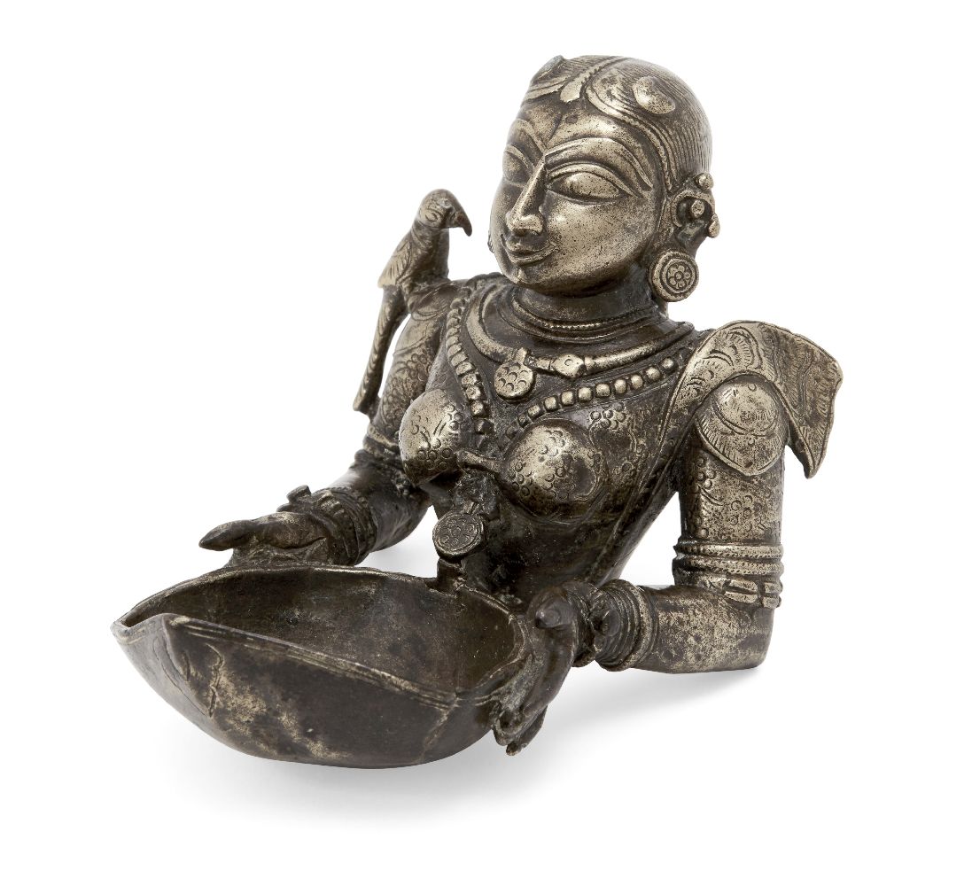 The upper section of a finely moulded brass figure of Meenakshi, the avatar of goddess Pavarti,