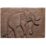 A carved wood panel in relief of an elephant, Rajasthan, India, 19th century, with traces of