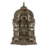 A Jain brass alter piece, Western India, 19th century, cast with a jina seated in meditation on a