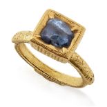 A South Indian sapphire ring, India, 18th century, the solid gold band engraved to shoulders with