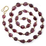 A spinel necklace, India, with thirty-seven polished spinels, each weighing between 12-15 carats,