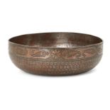 An engraved copper magic bowl, North India, 19th century, densely inscribed to interior, 20cm. diam.