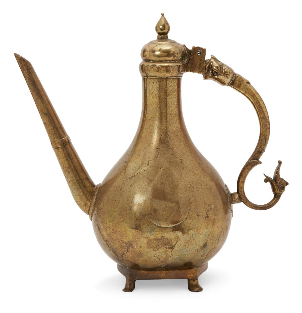 A unusually large cast brass lidded ewer, Mughal India, 18th century, the pear-shaped body on