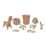 A group of Proto-Indus valley animal figures, comprising a three slip-painted vessels, a model of