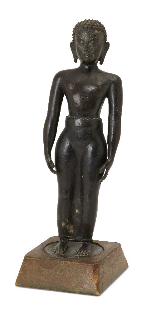 A Jain bronze figure of Tirthankara, South India, 17th century or earlier, on a flat, round base,