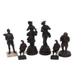 A group of six spelter figures, late 19th/20th century, comprising: a pair depicting an apple and