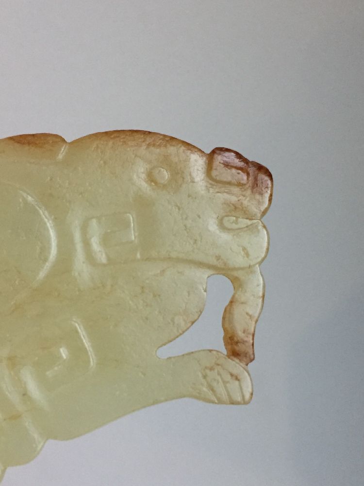 A rare Chinese yellow jade pendant, Western Zhou dynasty, carved as a stylised mythical beast with a - Image 9 of 11