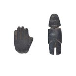 A carved stone Easter Island style figure, 17cm high; together with a carved a stoneware hand