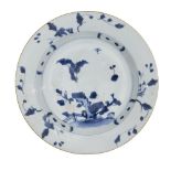 A Chinese porcelain plate excavated from the Nanking cargo, 18th century, painted in underglaze blue