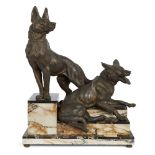 After Louis Albert Carvin, French, 1870-1935, two spelter Alsatians on a stepped two-colour marble