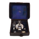 A silver communion set in leather case, London, c.1920, J Wippell & Co Ltd, comprising communion