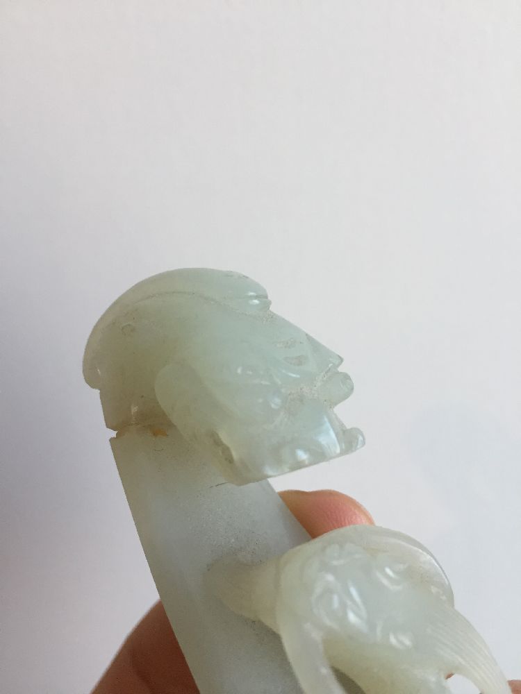 A Chinese pale green jade dragon belt hook, 18th century, carved with a dragon head terminal and a - Image 5 of 11