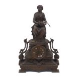 A cast iron mantle clock, 20th Century, the case of architectural stepped plinth form with scrolling