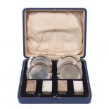 A cased silver smoking set, Birmingham, c.1936, Mappin & Webb, comprising four circular ashtrays and