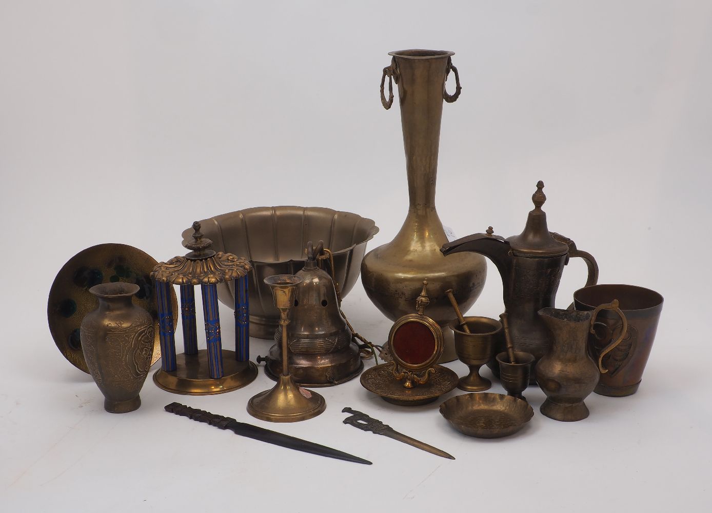 A collection of Eastern brass wares, 20th century, to include: a bowl of lotus form, a candlestick