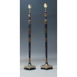 A pair of black painted and parcel gilt Chinoiserie floor lamps, early to mid 20th Century, with
