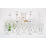 A quantity of glass table wares, 20th Century, to include a pair of cut glass decanters with diamond