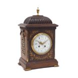 A French brass inlaid mahogany eight-day bracket clock, early 20th century, with brass urn finial