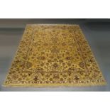 A modern oriental carpet of Ziegler design, the all over pattern in camel coloured field, 306cm x