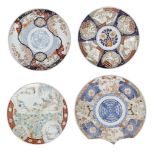 Four large Chinese porcelain Imari chargers, early 20th century, decorated with landscapes, figures,