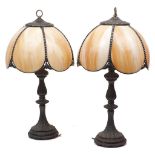 A pair of Art Nouveau style spelter table lamps, late 20th century, with floral cast bases and cream