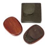 Two Chinese inkstones, 20th century, one of square form inscribed with a poem to the front and