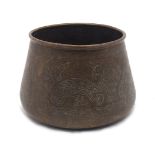 A Middle Eastern incised brass bowl, hammered and engraved brass with geometric designs, with