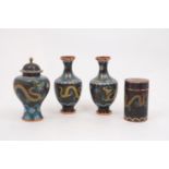 A pair of Chinese cloisonné baluster vases, 20th Century, each of black ground depicting a dragon