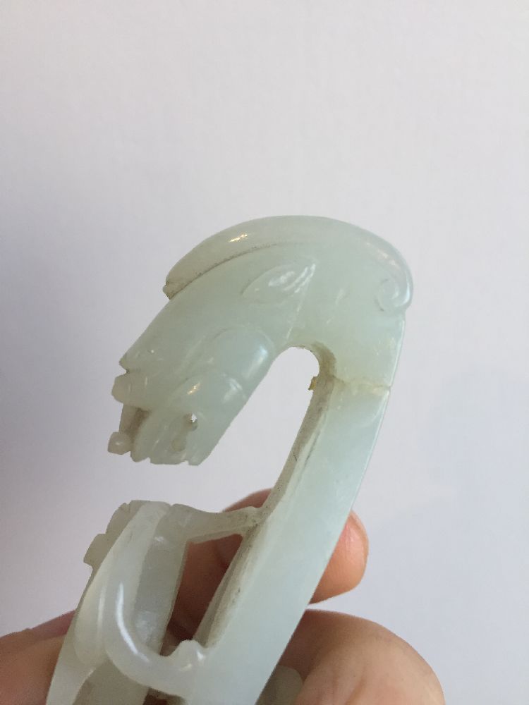 A Chinese pale green jade dragon belt hook, 18th century, carved with a dragon head terminal and a - Image 7 of 11