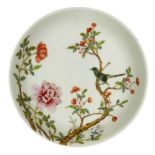 A Chinese porcelain saucer dish, Guangxu mark, Republic period, painted in famille rose enamels with