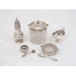 A small group of silver items comprising: an Edwardian silver mounted cut glass biscuit barrel,